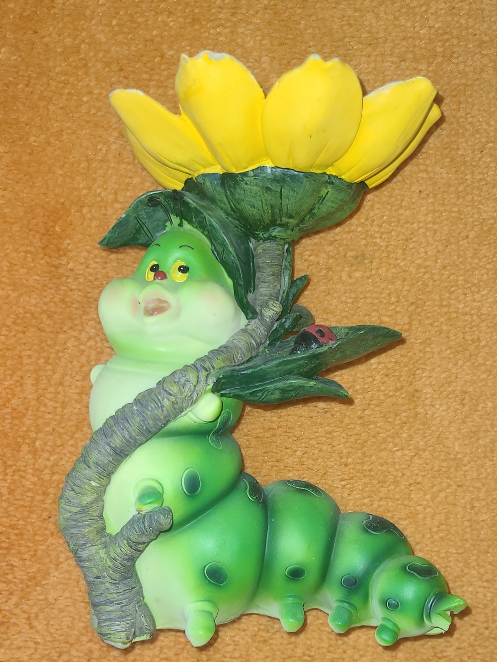 Green Caterpillar Figurine with Yellow Flower